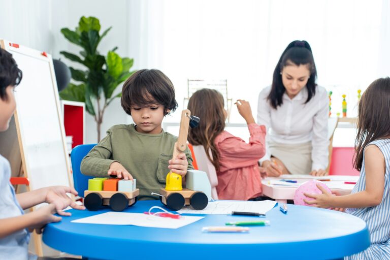 Children playing and drawing with teacher | The Fort Learning Community